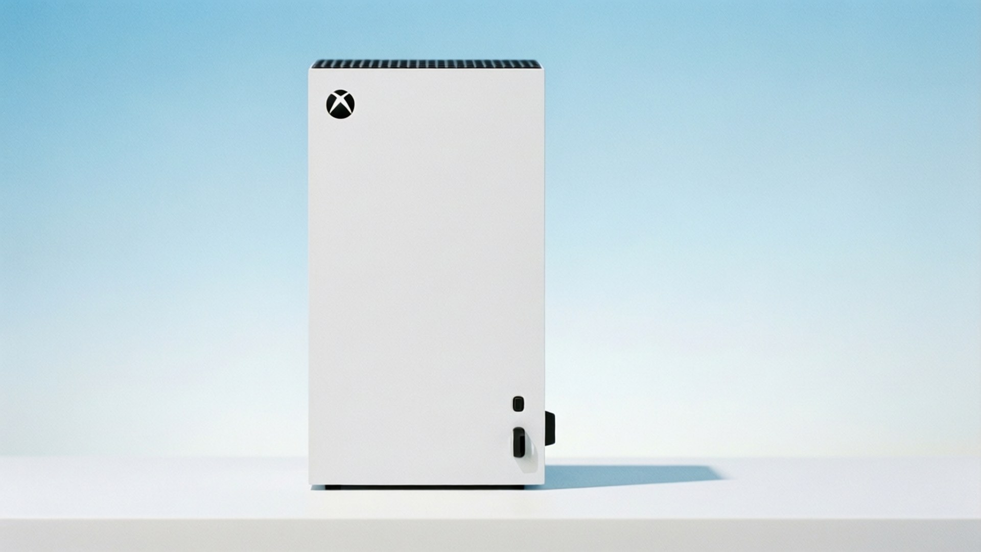 White Xbox Series S 壁紙 — 一部流線型白色Xbox主機直立於白色表面上，背景為柔和漸變藍色。