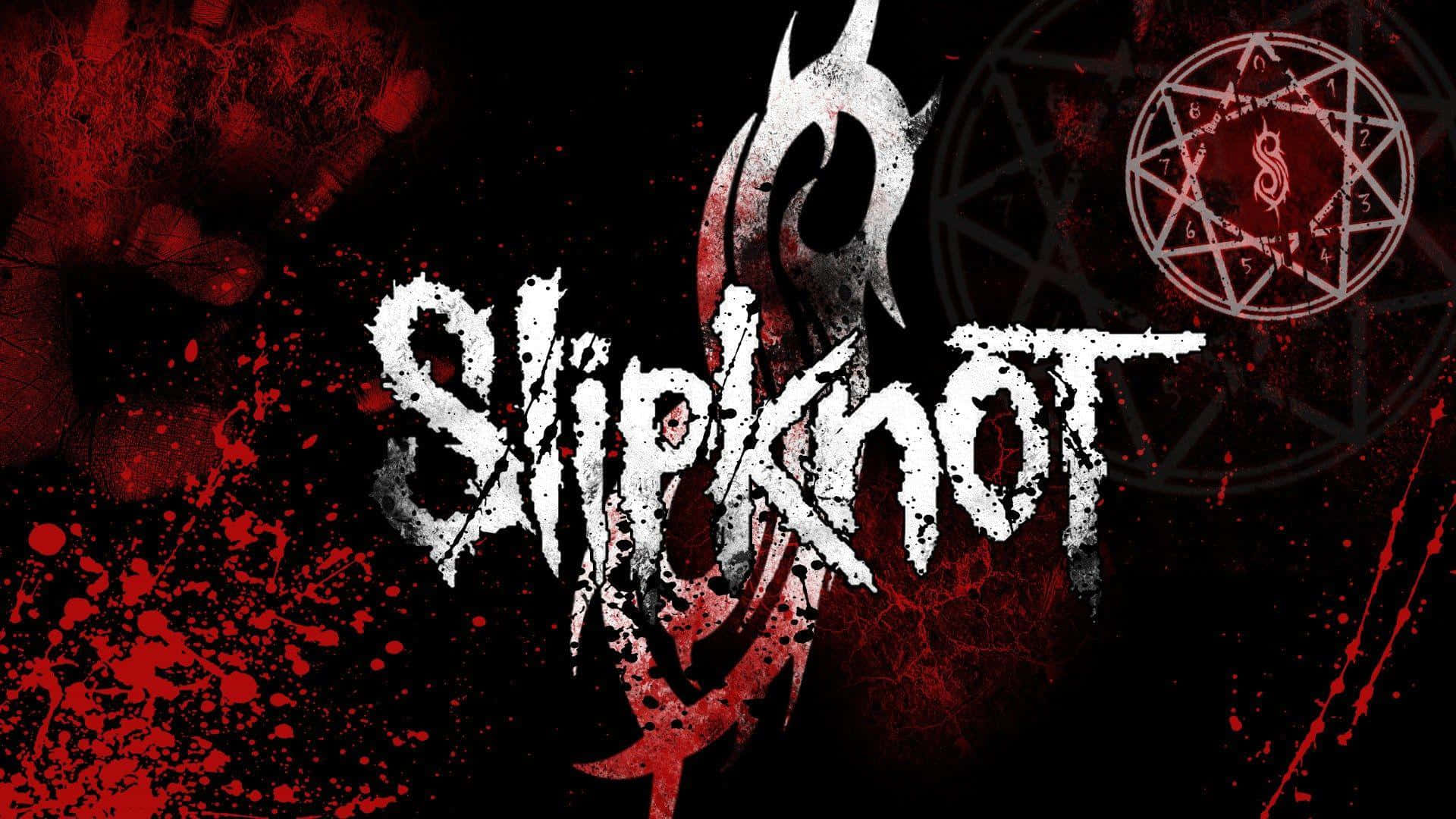 Slipknot 桌布 壁紙 — Slipknot 樂隊標誌在黑色背景上濺上紅色油漆，並帶有神秘符號。