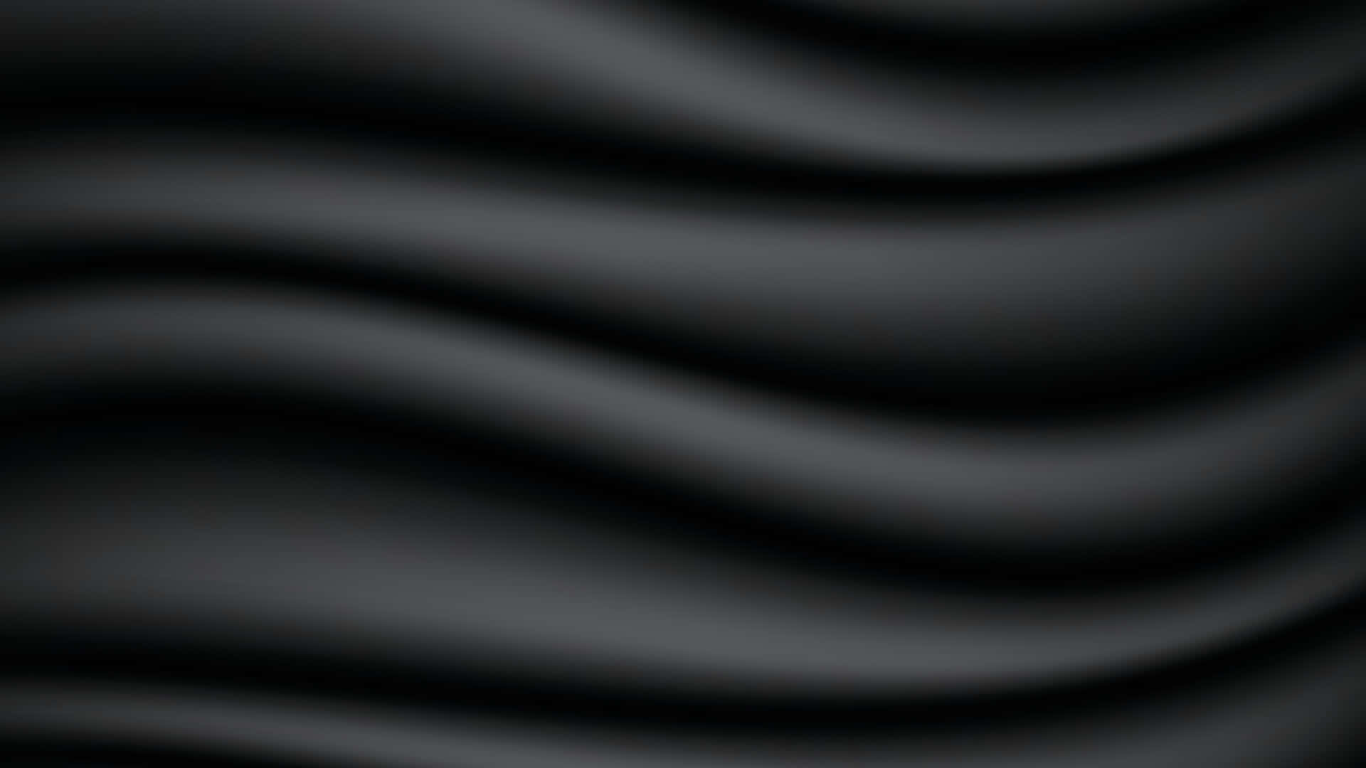  壁紙 — 光滑深灰色布料，帶有柔和起伏的波浪和細微高光，營造出極簡抽象紋理。