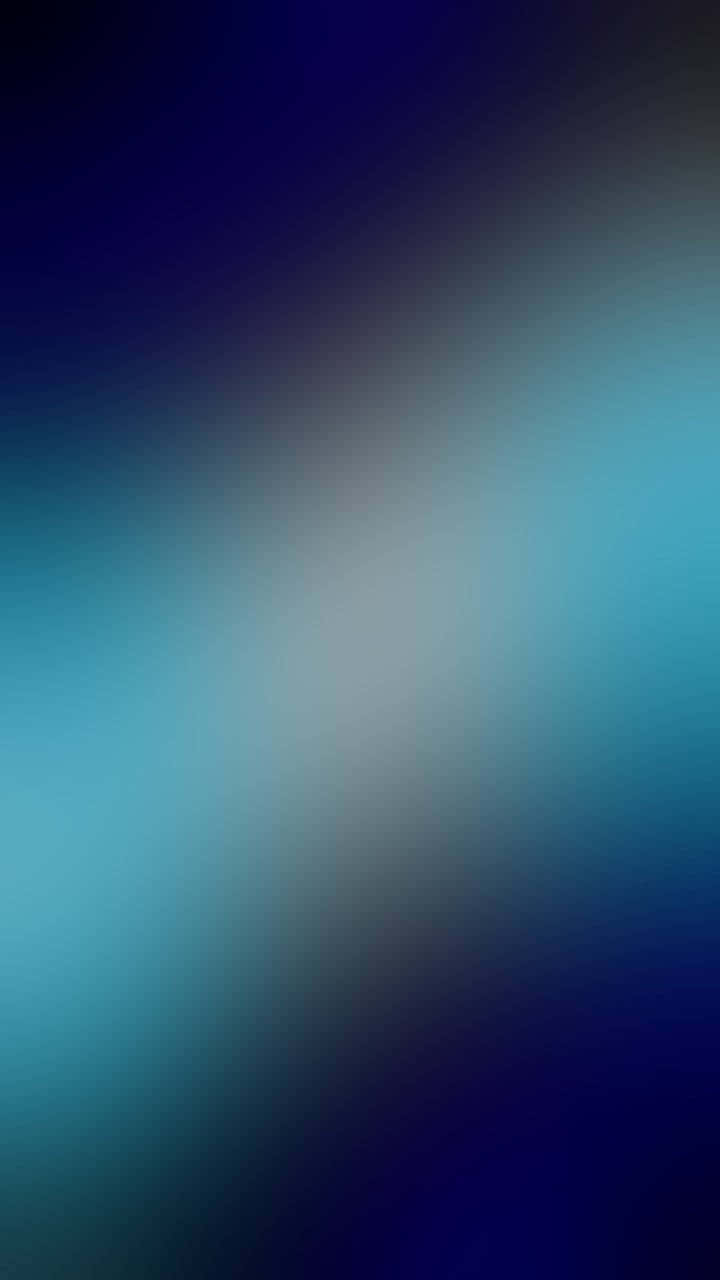  壁紙 — 從深藍色到藍綠色的平滑漸變，中心帶有柔和光芒，營造出平靜的抽象背景。