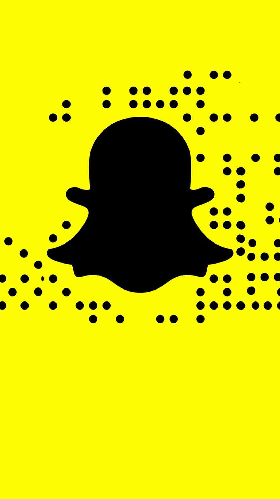  壁紙 — 一個大膽的黑色Snapchat鬼魂標誌，居中在充滿活力的黃色背景上，帶有散落的黑色圓點。