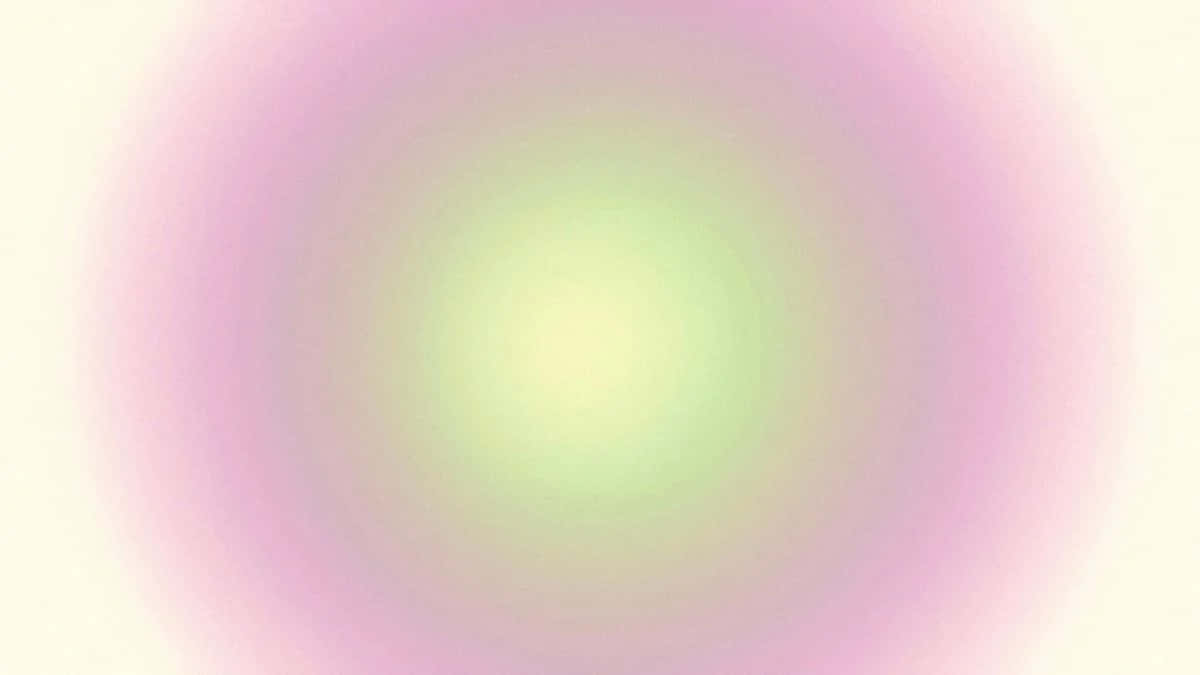  壁紙 — 柔和的粉紅與粉綠漸變漩渦從明亮的中心向外擴散。