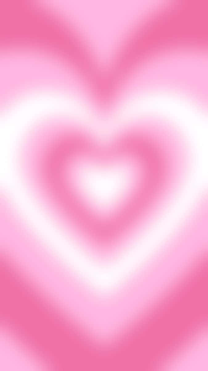 Pink Heart Aura 桌布 壁紙 — 粉紅色調的柔和漸層形成同心心形，從明亮的中心向外輻射。