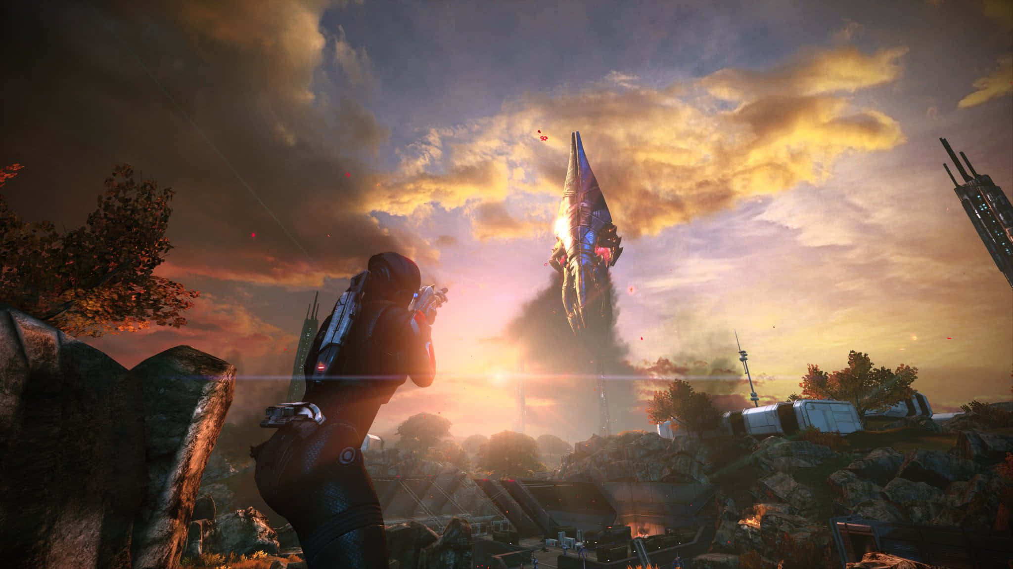 Mass Effect Legendary Edition 桌布 壁紙 — 一名孤獨的士兵在日落時分，將武器瞄準一艘從廢墟戰場上升起的巨大外星飛船。
