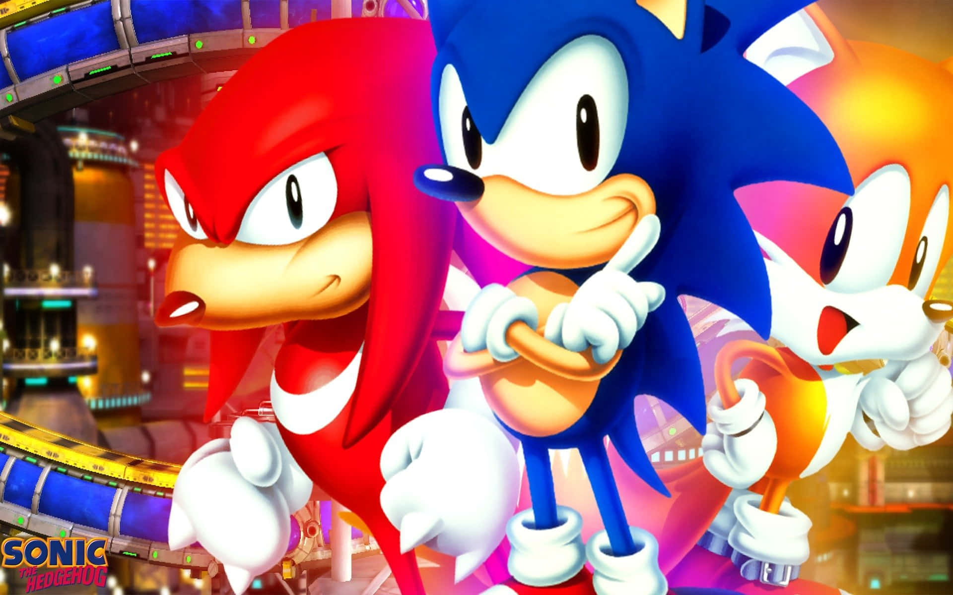 Sonic And Knuckles 桌布 壁紙 — Sonic、Knuckles 和 Tails 英雄般地站在一個充滿活力的未來城市景觀中，周圍是發光的霓虹燈和賽道。