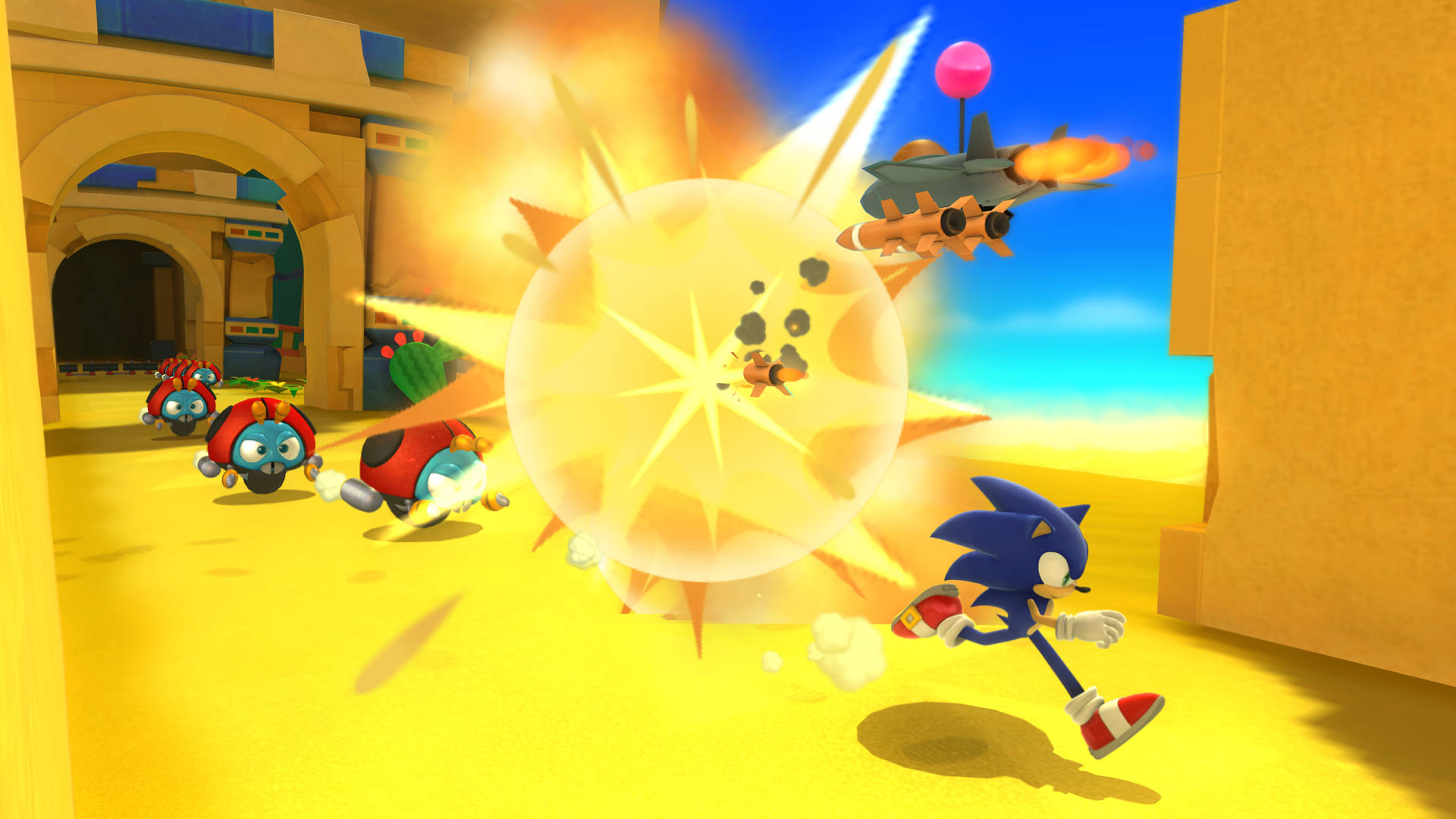 World 桌布 壁紙 — Sonic the Hedgehog 衝過巨大爆炸，機械敵人和噴射機在陽光明媚的沙漠峽谷中追趕他。