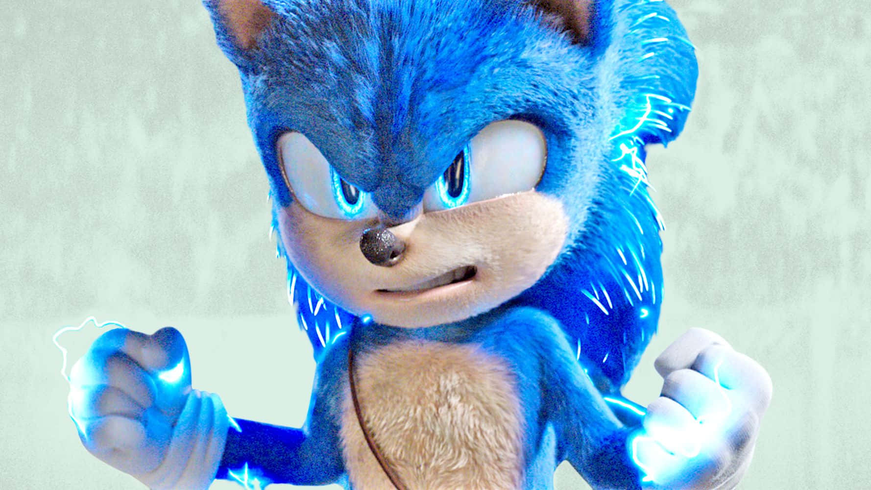 Sonic The Hedgehog 桌布 壁紙 — Sonic the Hedgehog 以動感姿勢站立，拳頭周圍閃爍著藍色光芒的能量，背景為柔和的灰色。