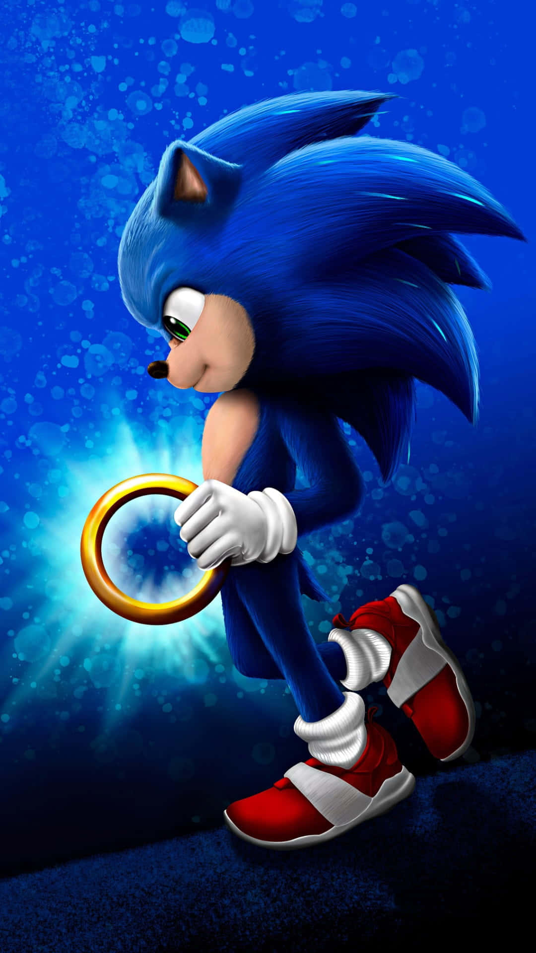 索尼克 桌布 壁紙 — Sonic the Hedgehog 以動態姿勢手持發光金色戒指，背景為充滿光爆的鮮豔藍色。