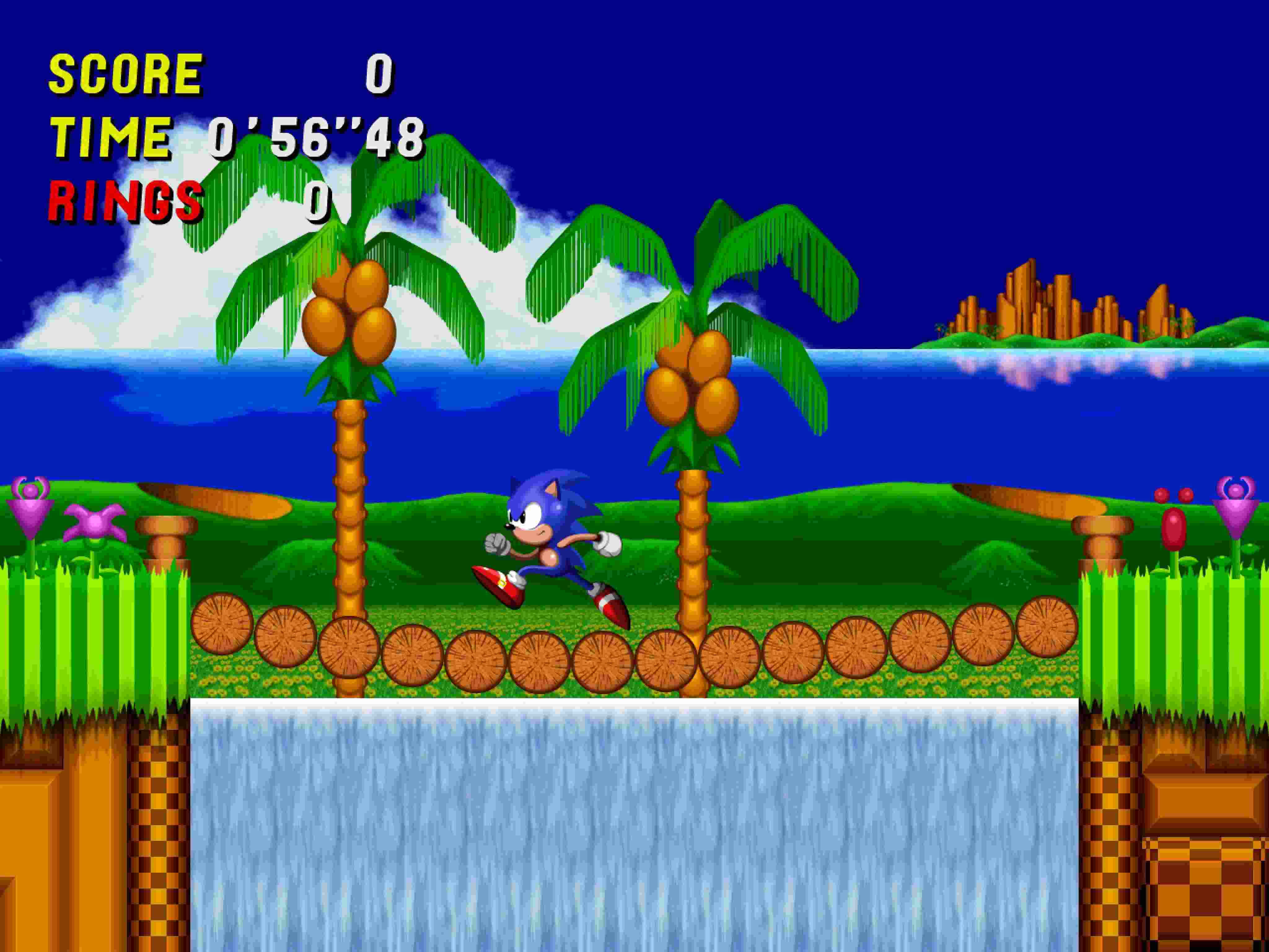Sonic 2 桌布 壁紙 — Sonic the Hedgehog 在一個有棕櫚樹、瀑布和遊戲HUD元素的像素化熱帶關卡中奔跑。