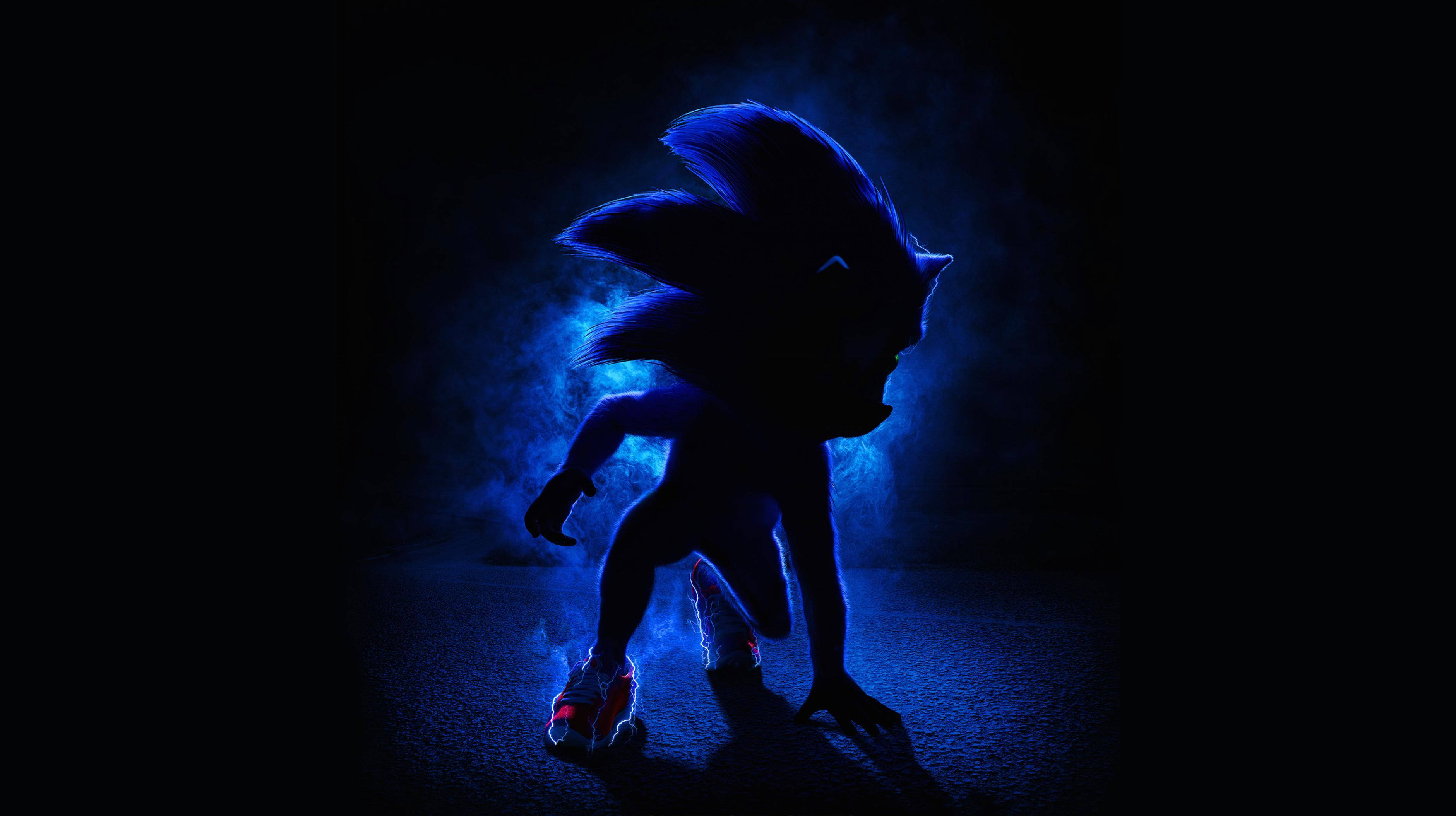 電玩遊戲 桌布 壁紙 — Sonic the Hedgehog 在黑暗煙霧背景中以發光藍色剪影呈現。