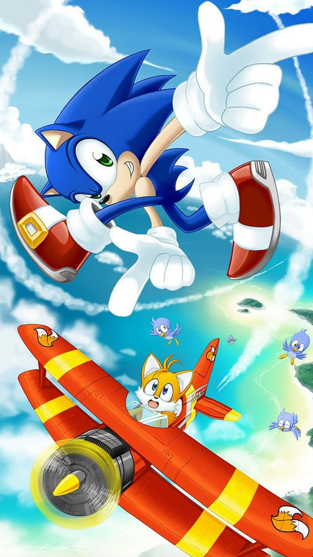 Sonic Adventure HD 桌布 壁紙 — Sonic the Hedgehog 在晴朗藍天和 fluffy 雲朵背景下，飛在 Tails 的紅色雙翼機上方豎起大拇指。