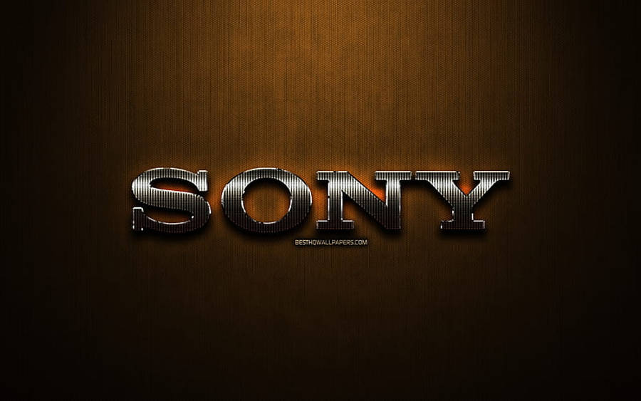 Sony 桌布 壁紙 — Sony 標誌在溫暖的漸層背景上，帶有微妙的燈光效果，呈現金屬質感的光澤。