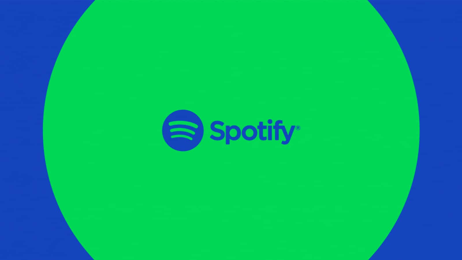 Spotify 桌布 壁紙 — Spotify 標誌居中在鮮綠色圓圈內，背景為大膽的藍色。
