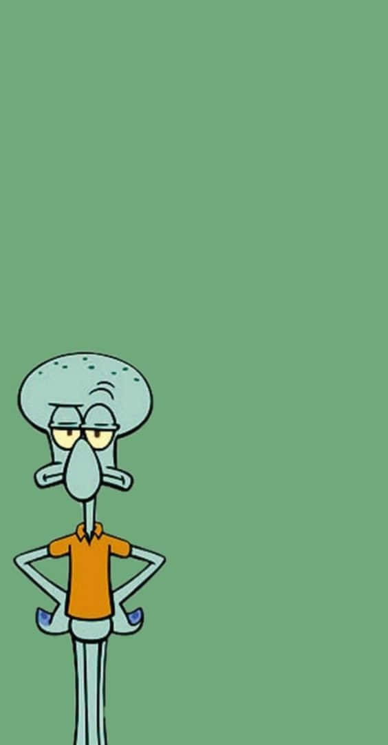 Aesthetic Squidward 桌布 壁紙 — Squidward 雙手叉腰站在純綠色背景前，看起來既惱火又無聊。