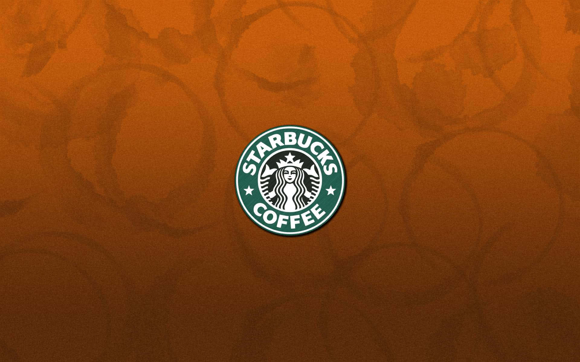 星巴克 桌布 壁紙 — Starbucks Coffee 標誌居中於帶有微妙圓形圖案的紋理橙色背景上。