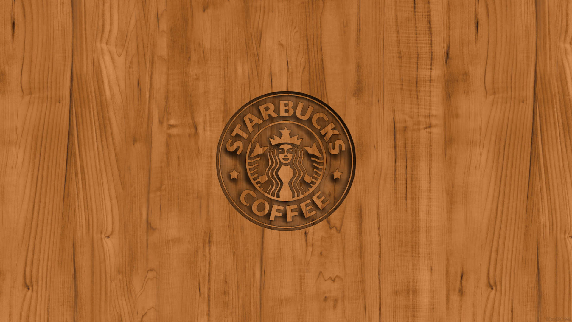 星巴克 桌布 壁紙 — Starbucks 標誌雕刻在溫暖的木質表面上，帶有天然木紋紋理。