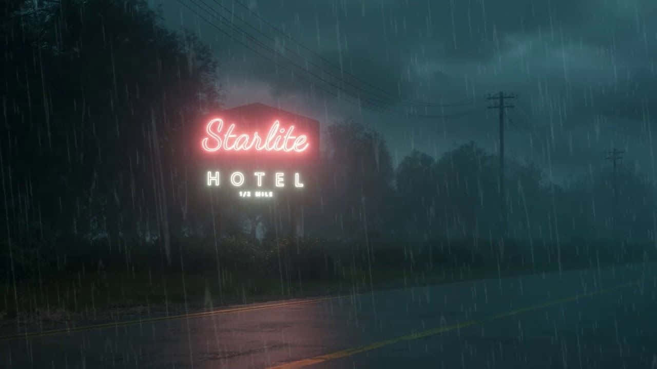 桌布 壁紙 — Starlite 酒店發光的霓虹燈招牌在夜間黑暗的路邊大雨中閃爍。