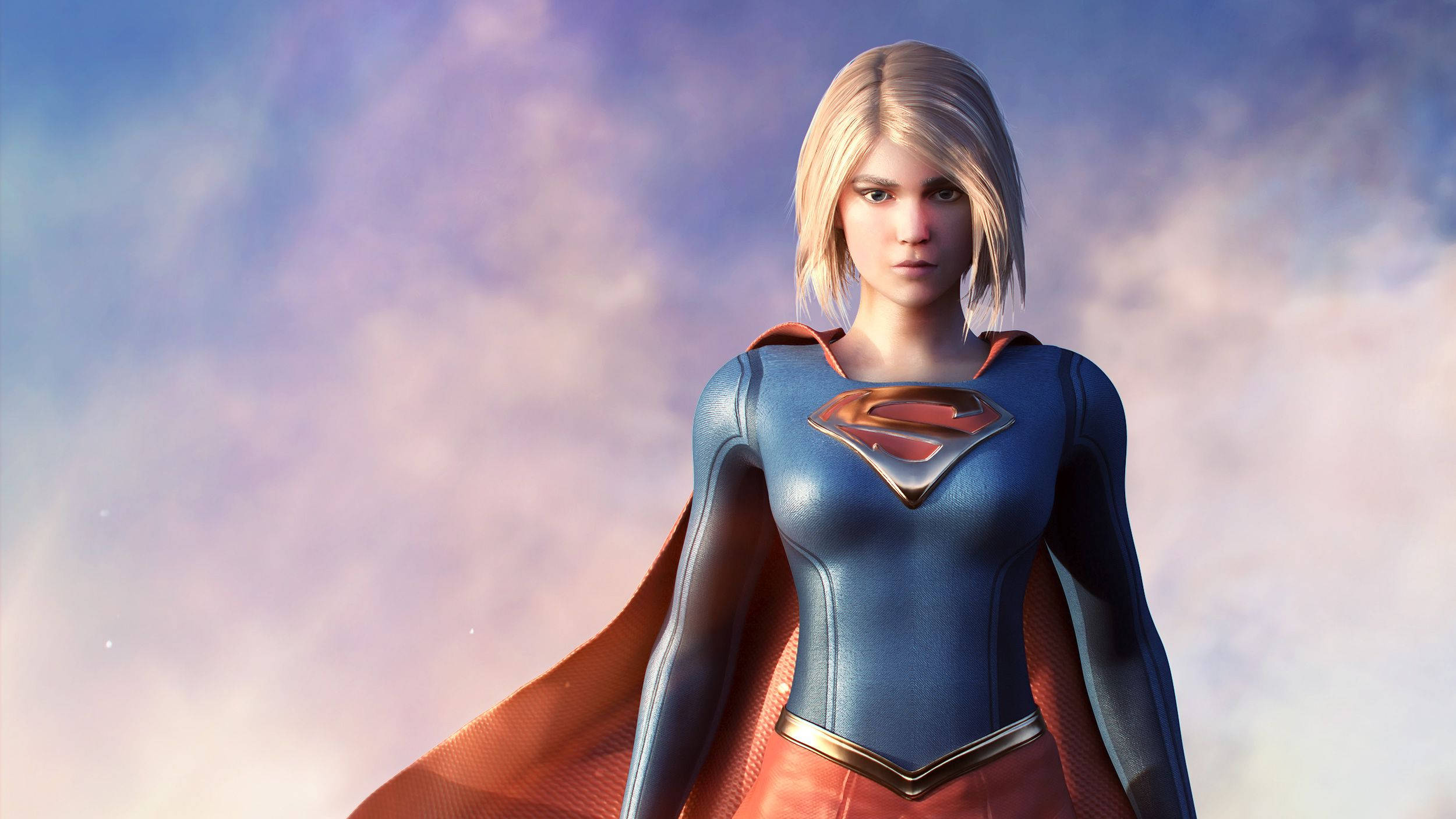 Superwoman 桌布 壁紙 — Supergirl 自信地站立，身穿藍色和紅色套裝，背景是柔和粉彩天空和薄雲。
