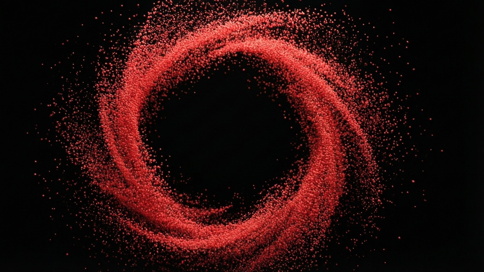 Particle Red Circle Swirl 壁紙 — 一個由發光紅色粒子形成的漩渦，在深黑色背景上構成完美圓環。