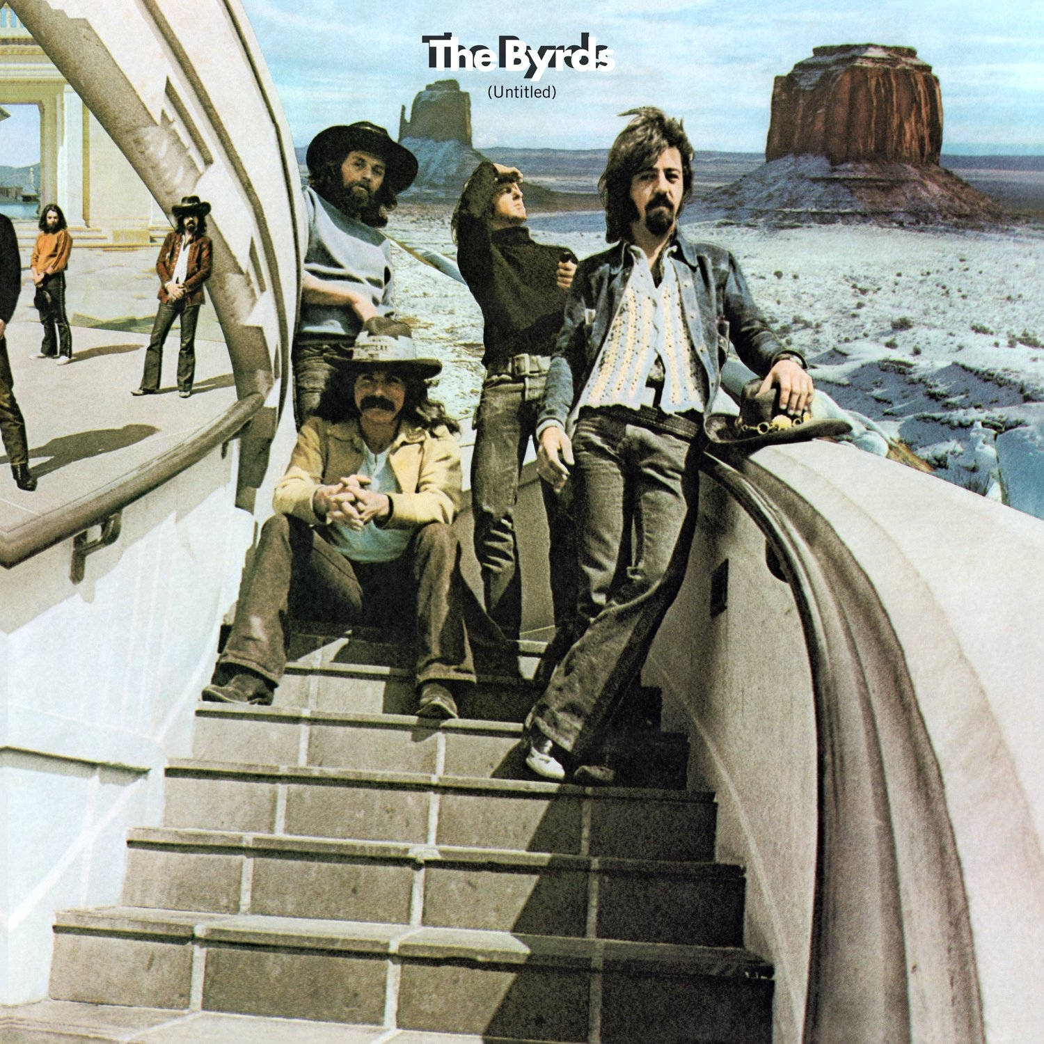 岩石 桌布 壁紙 — The Byrds 樂團成員在晴朗天空下，以沙漠背景和岩石地貌為襯托，在彎曲樓梯上擺姿勢。