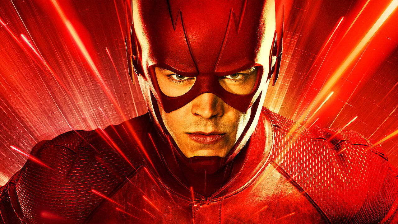 閃電俠 桌布 壁紙 — The Flash 專注地向前凝視，紅色閃電痕跡在他身後放射，展現出動態的超級英雄姿勢。