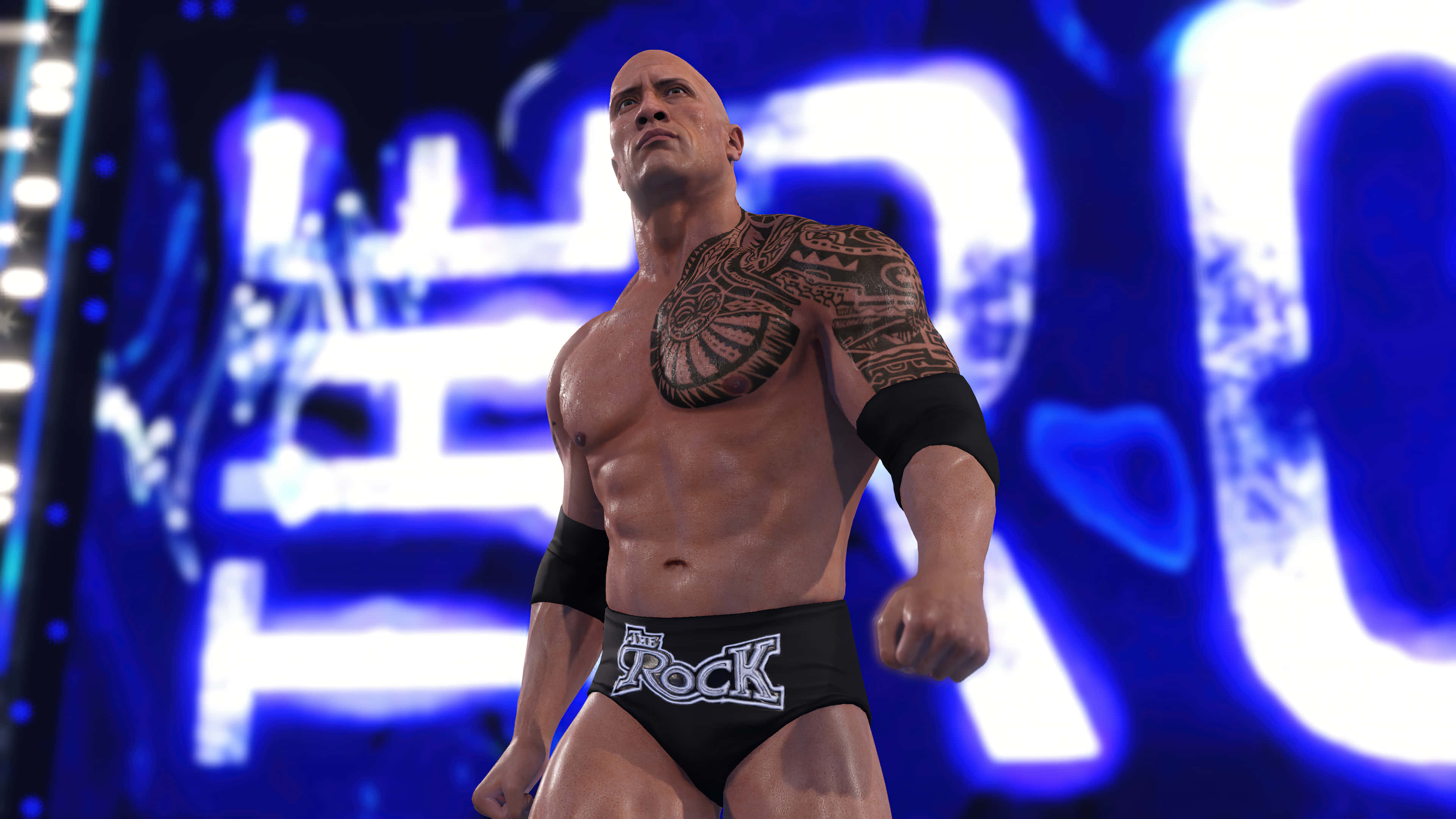 WWE 桌布 壁紙 — The Rock 在明亮的藍色燈光下強勢地站在摔角擂台上，背後有發光的「ROCK」字樣。