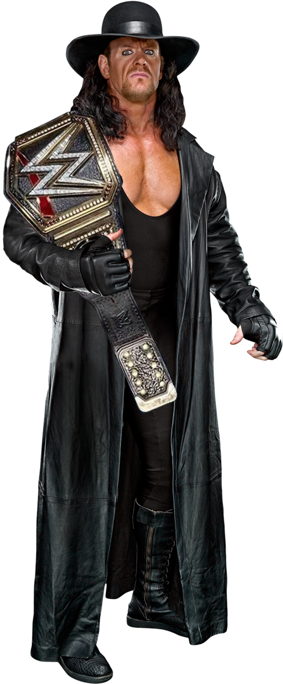 Undertaker 桌布 壁紙 — The Undertaker 身穿全黑服裝，手持WWE冠軍腰帶，站在純白背景前，氣勢逼人。