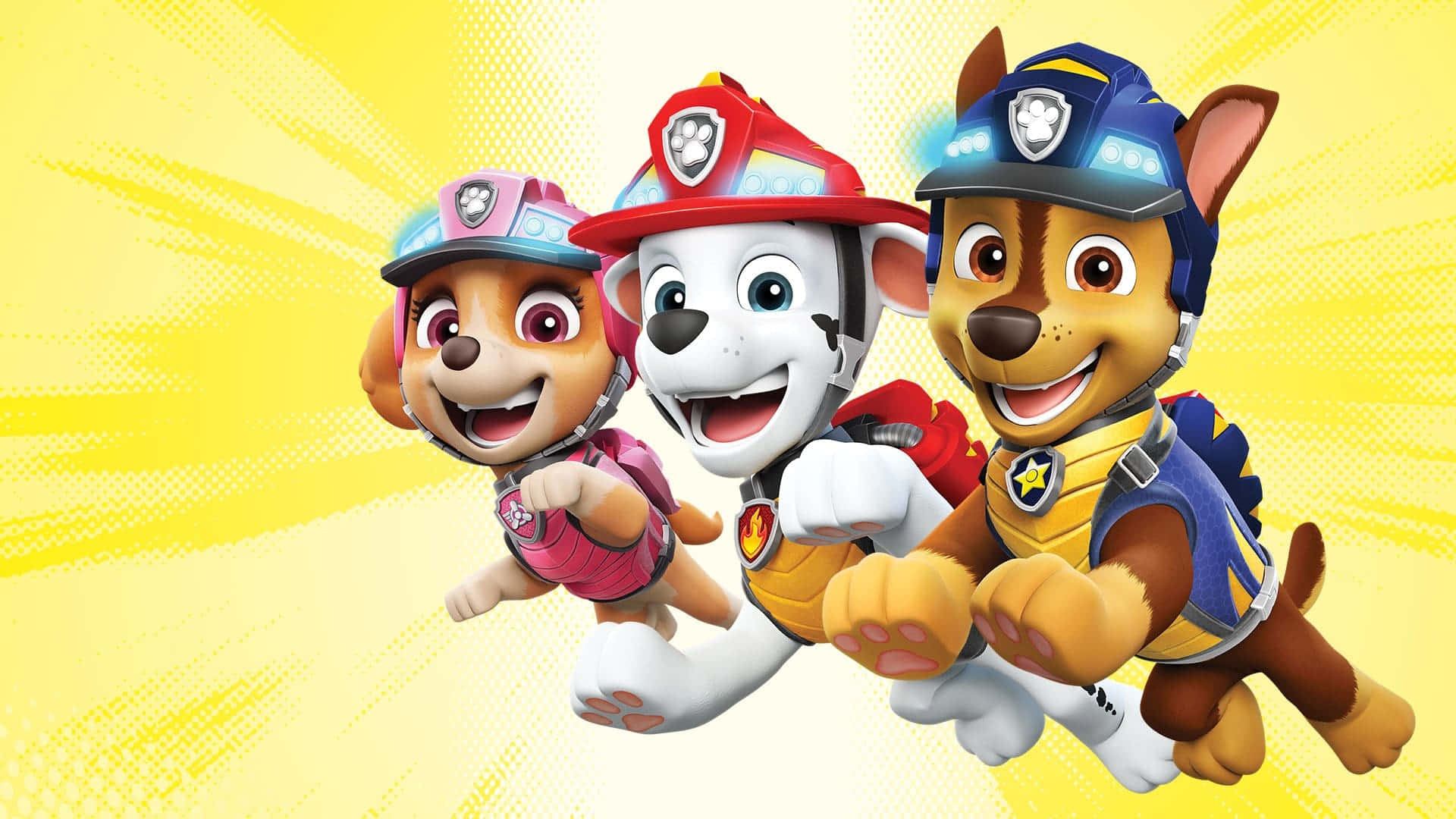  壁紙 — 三隻穿著救援裝備的開心Paw Patrol小狗，在明亮的黃色漫畫風格背景前向前衝刺。