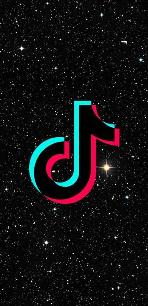 桌布 壁紙 — TikTok 標誌在充滿星空的宇宙背景下散發出充滿活力的青綠色和粉紅色光芒。