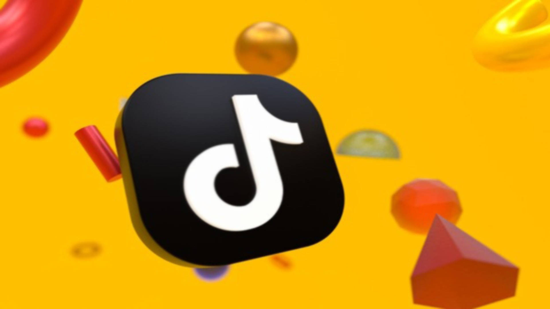 TikTok 動圖 桌布 壁紙 — TikTok 標誌居中，背景為充滿活力的黃色，帶有漂浮的彩色幾何形狀。