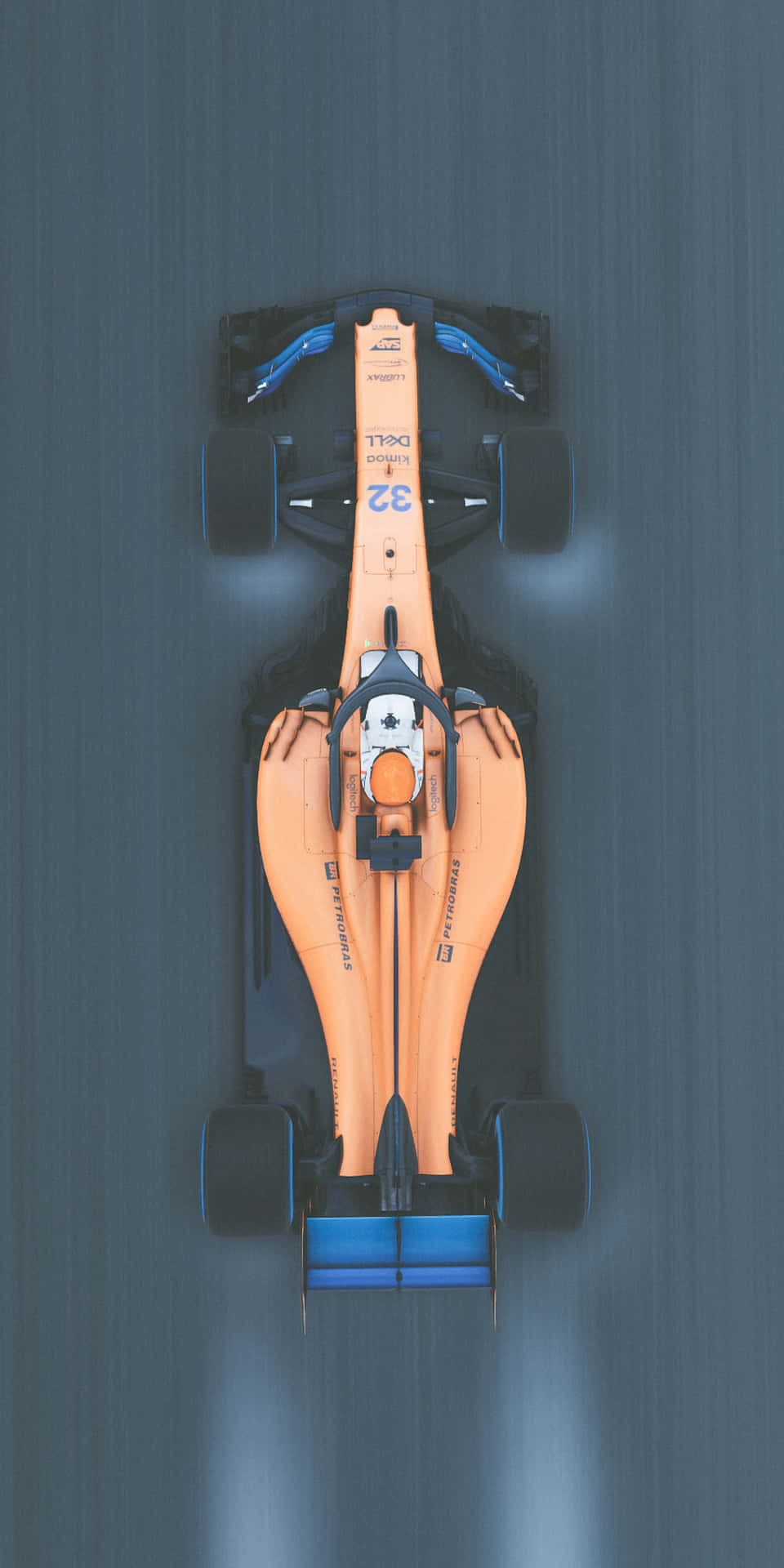 橙色和藍色的一級方程式賽車在賽道上從上方疾馳。 — F1 壁紙