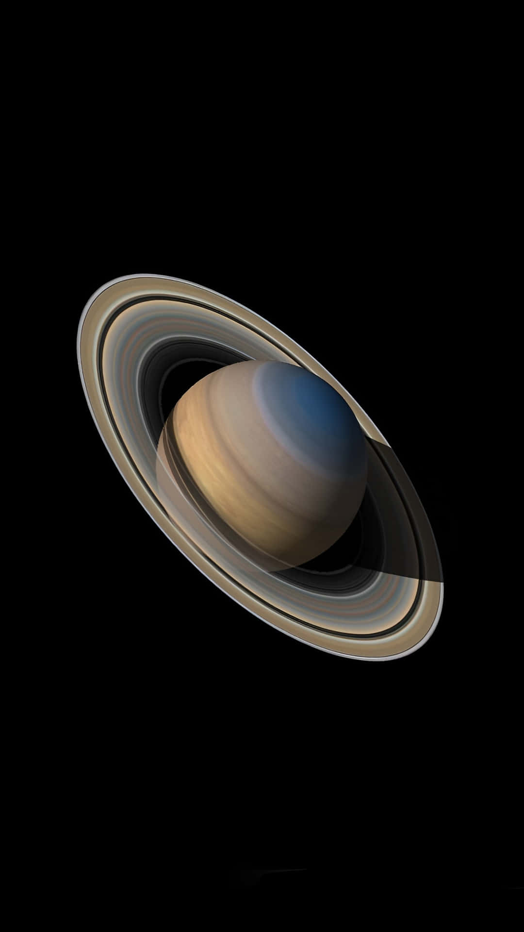  壁紙 — 土星及其標誌性的光環在深邃的太空黑暗中柔和發光，呈現出一幅令人驚嘆的天體肖像。