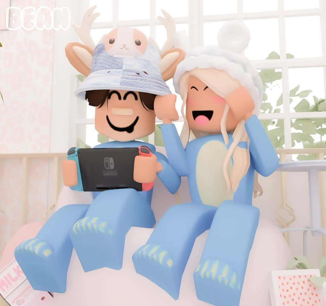 兩個穿著藍色睡衣的Roblox角色在窗邊開心地玩Nintendo Switch。 — Roblox 壁紙
