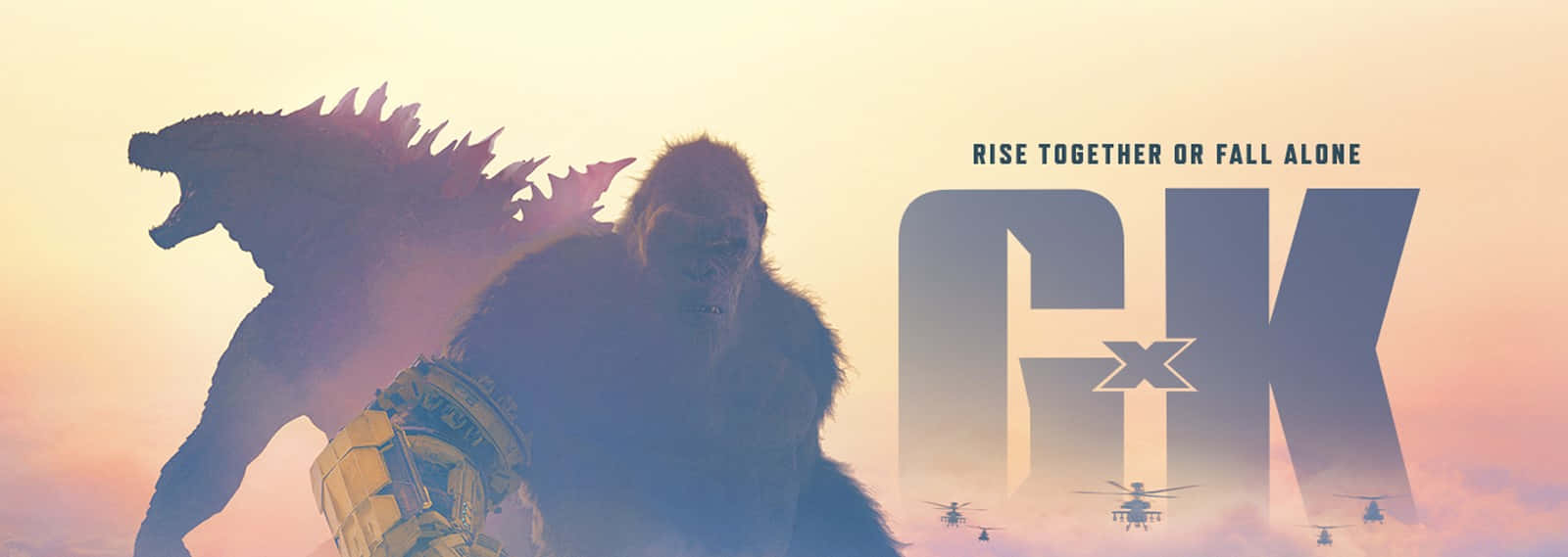 Godzilla X Kong The New Empire 桌布 壁紙 — 兩隻巨大的怪獸哥吉拉和金剛站在發光的日落背光下，直升機在下方飛行。