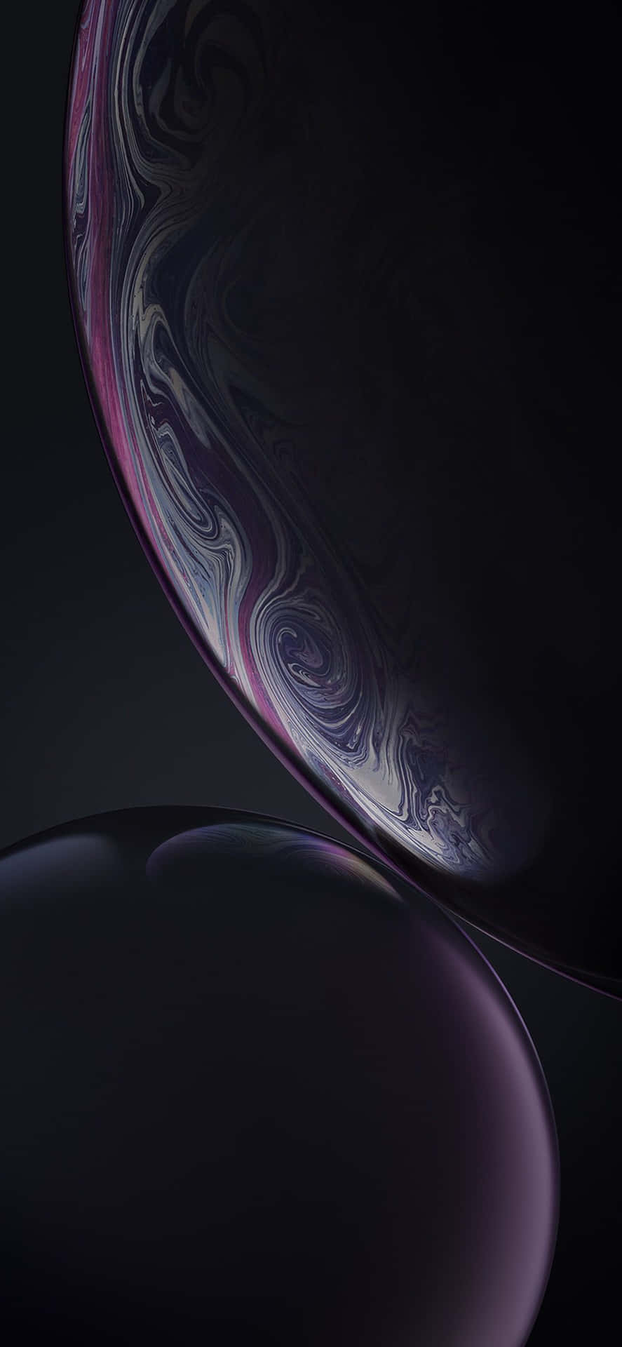 兩個漂浮的球體，帶有紫色和銀色漩渦圖案，在深色背景上 — iPhone 11 Pro Max 壁紙