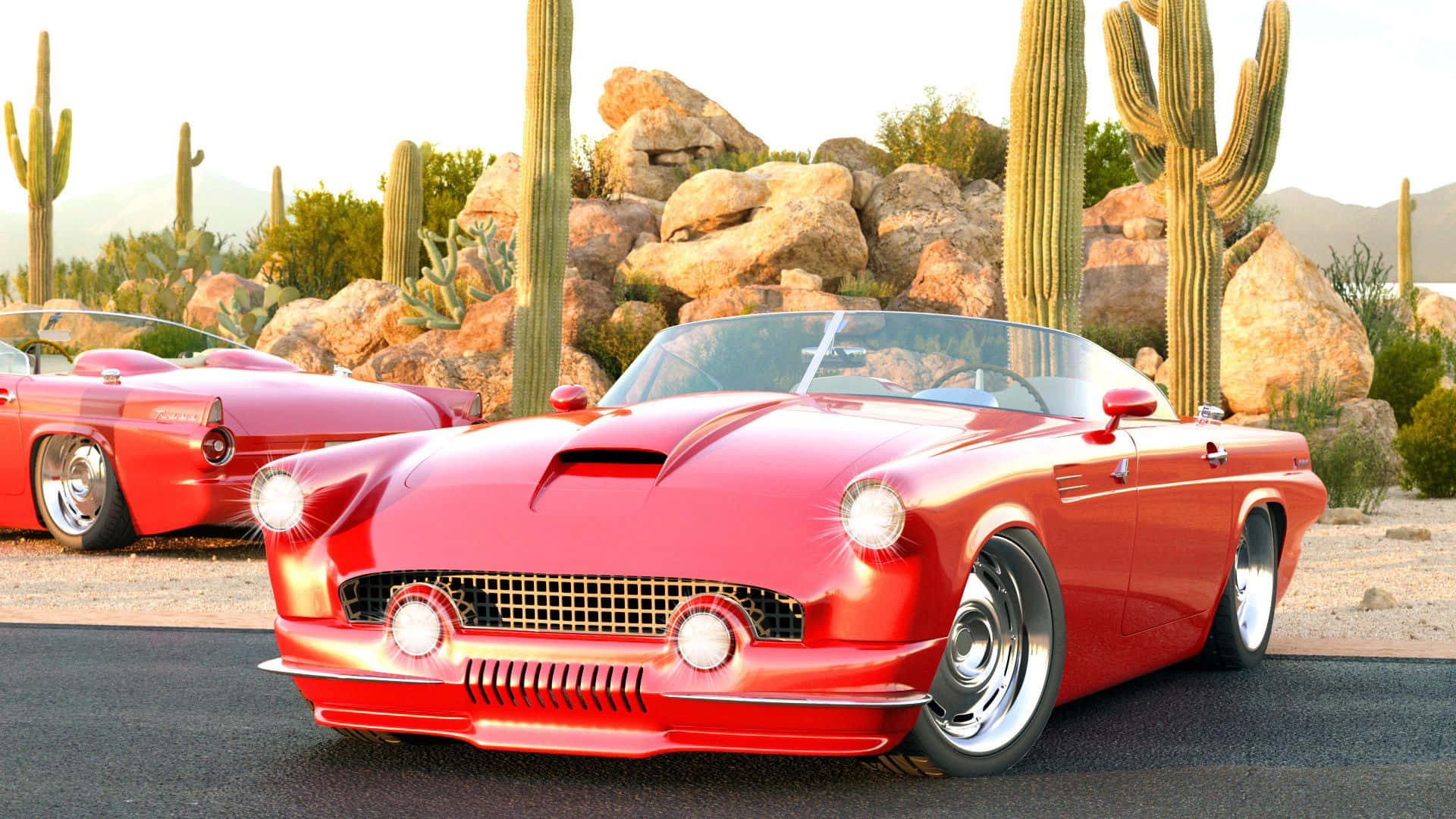 Ford Thunderbird 桌布 壁紙 — 兩輛閃亮的紅色經典敞篷車停在沙漠地面上，旁邊是高聳的薩瓜羅仙人掌和岩石地形。