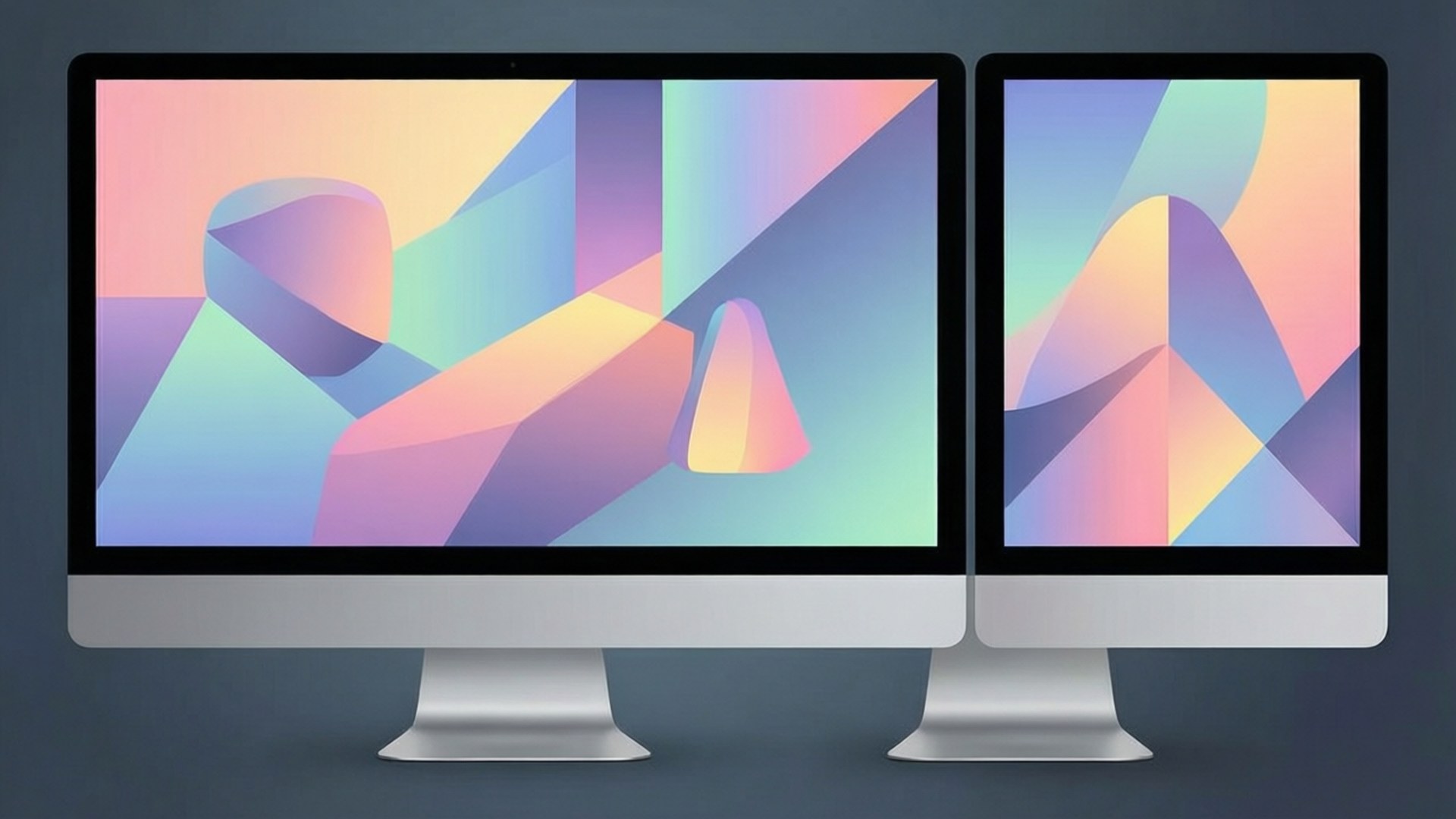 Abstract Shapes Dual 壁紙 — 兩部時尚的銀色 iMac 在深灰色背景上顯示充滿活力的抽象幾何壁紙，帶有柔和的粉彩漸變。