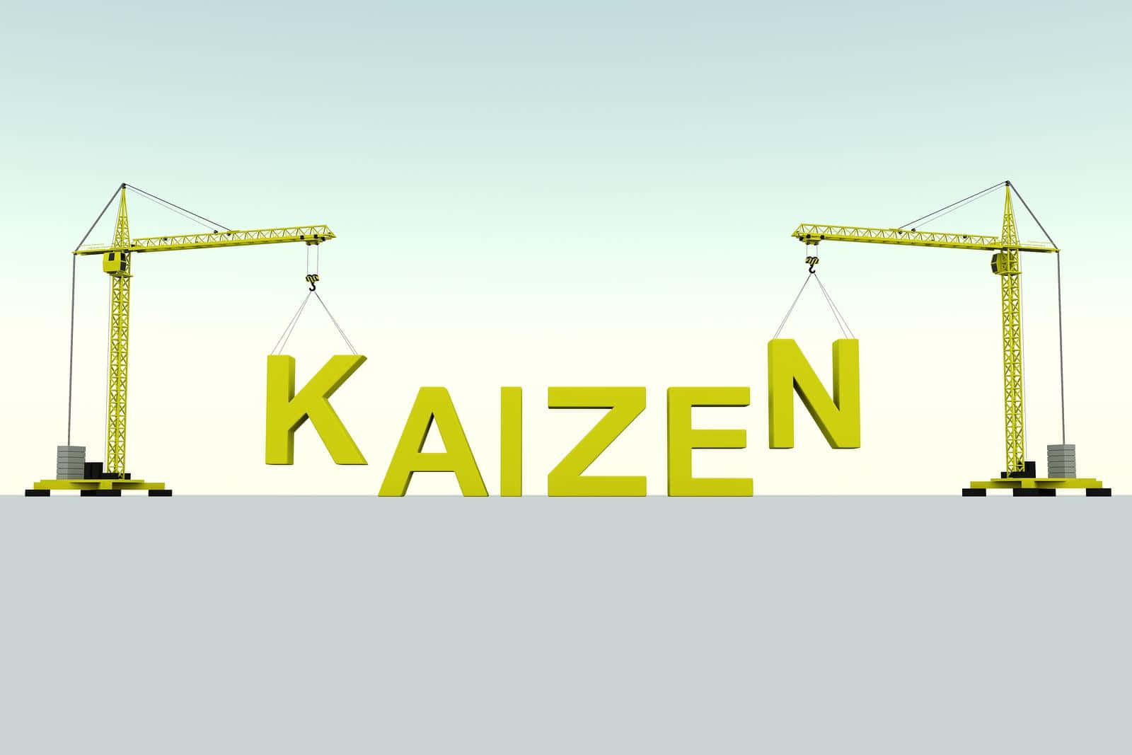  壁紙 — 兩部黃色起重機在漸變天空背景下吊起拼寫KAIZEN的大型3D字母。