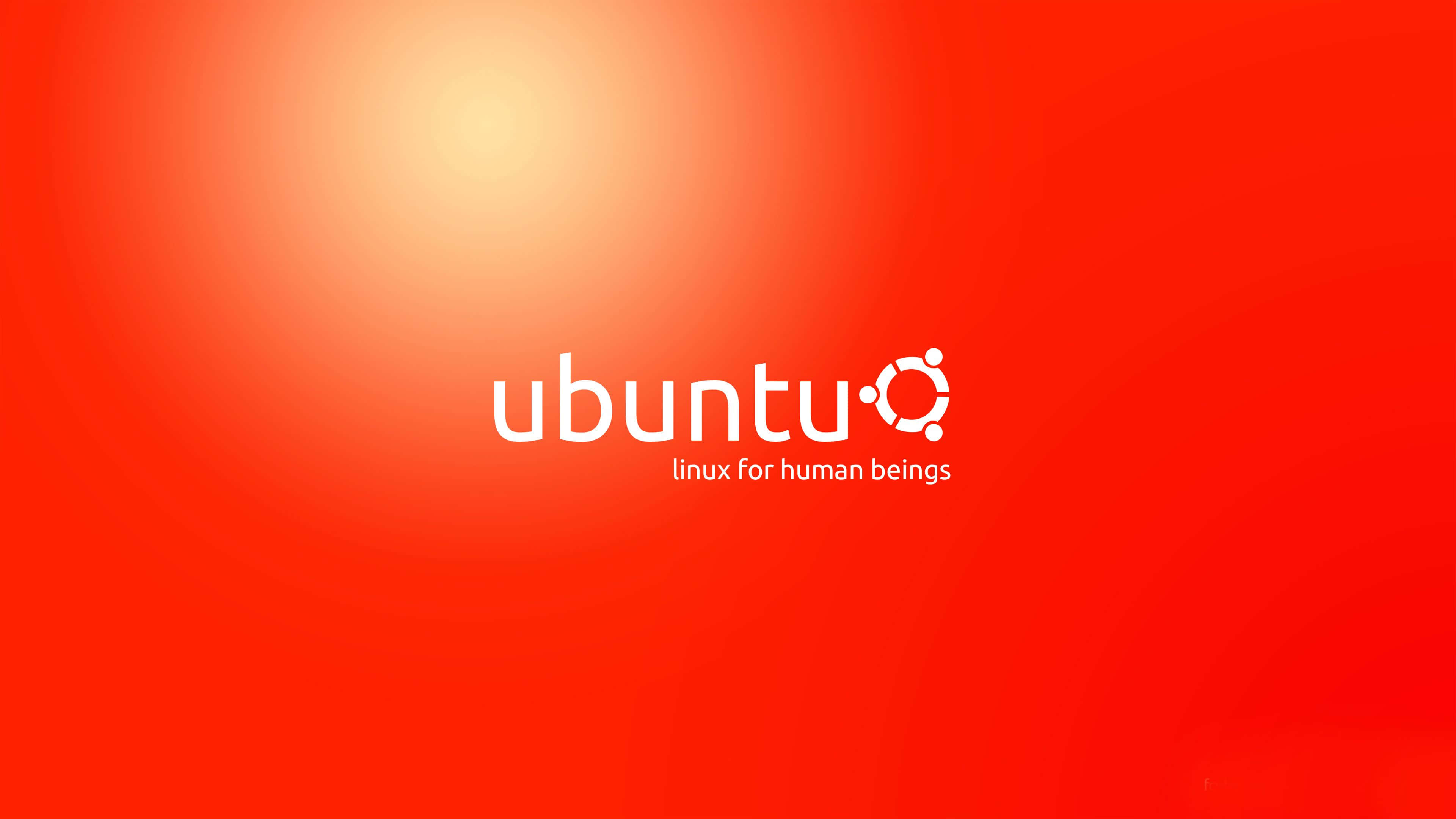 Ubuntu 4K 桌布 壁紙 — Ubuntu 標誌以白色文字呈現，背景為鮮豔的紅色漸變，帶有柔和的光暈。