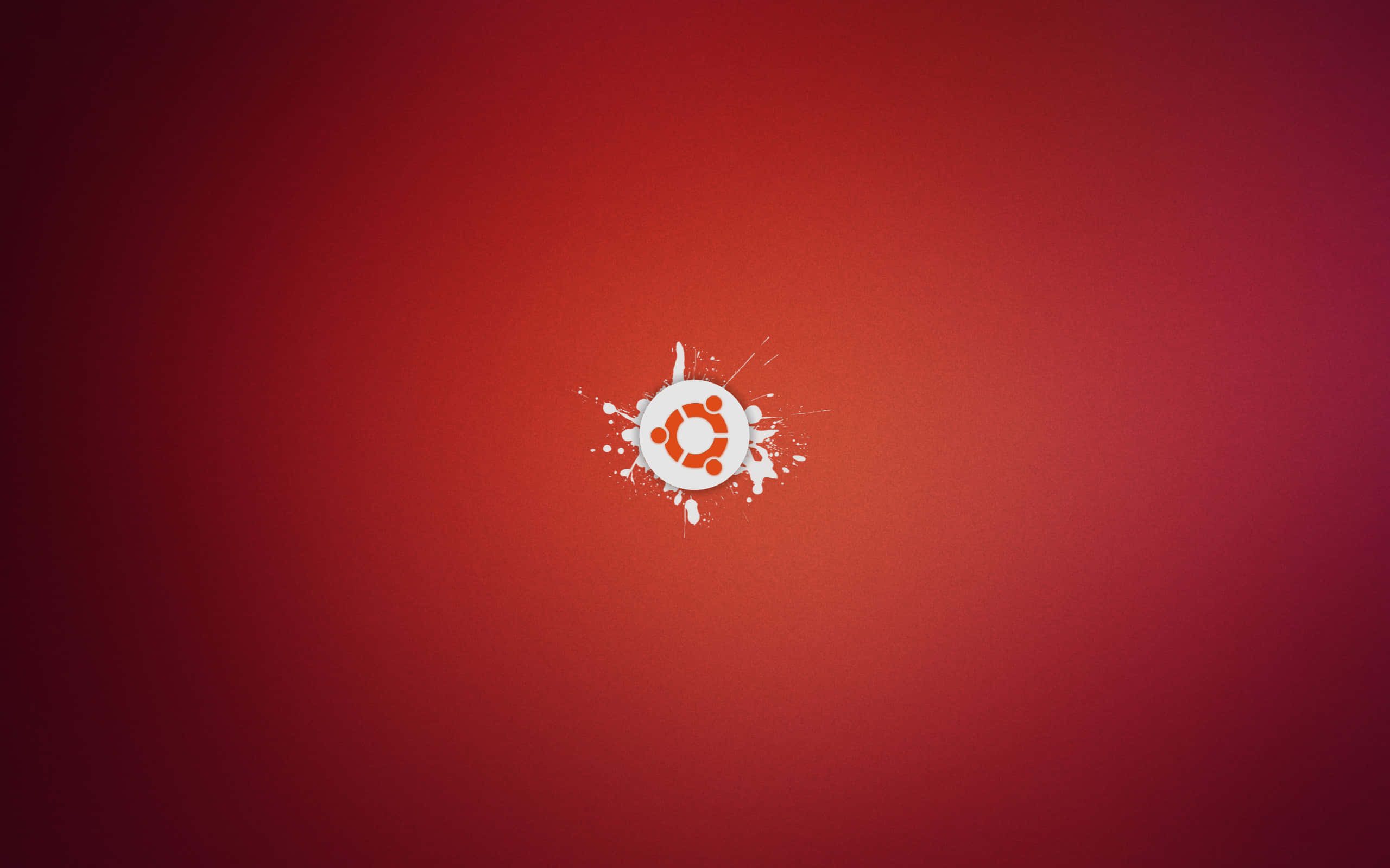 ubuntu 桌布 壁紙 — Ubuntu 標誌在漸變紅色背景上濺上白色油漆。