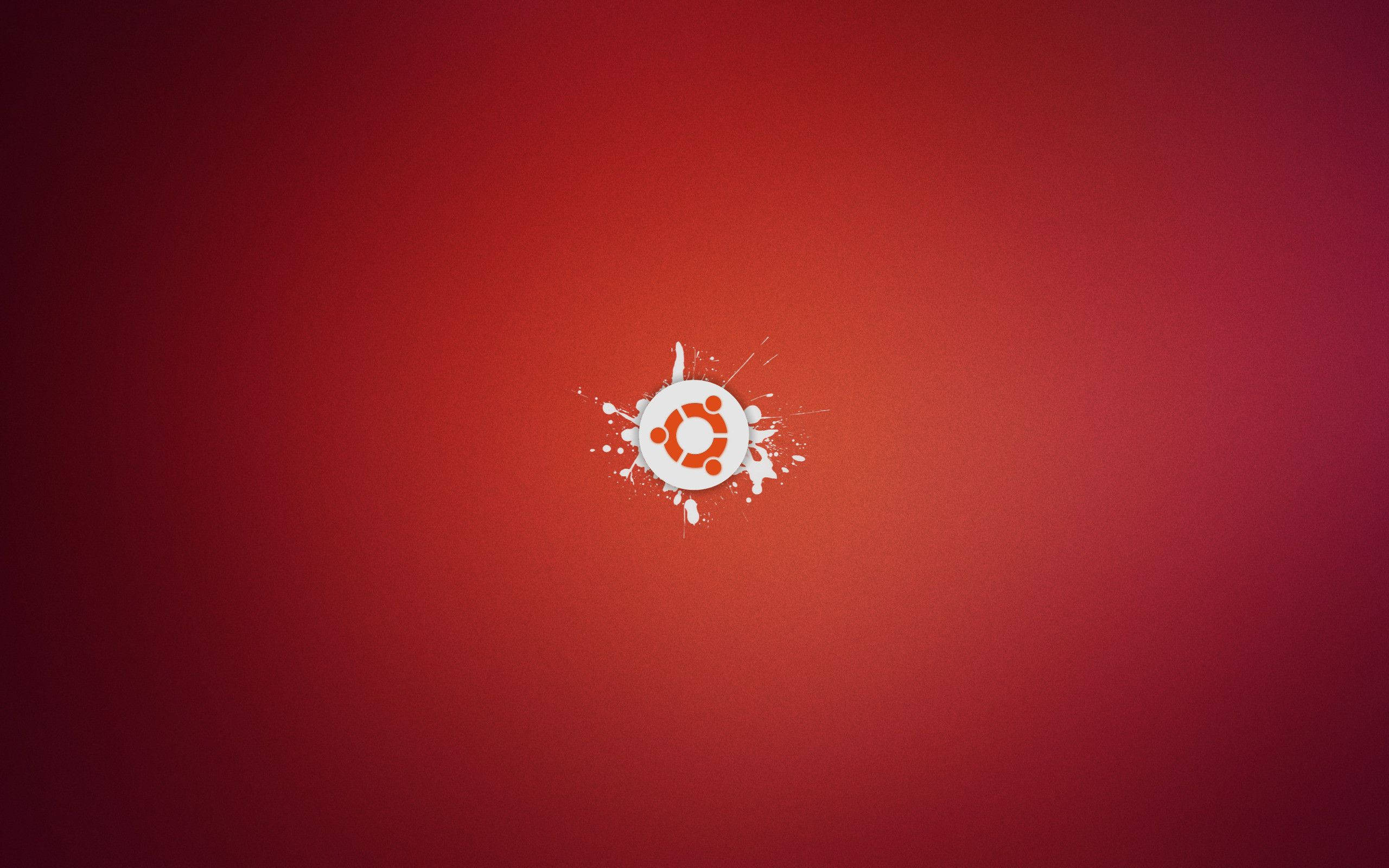ubuntu 桌布 壁紙 — Ubuntu 標誌居中放在漸變紅色背景上，帶有白色油漆飛濺效果。