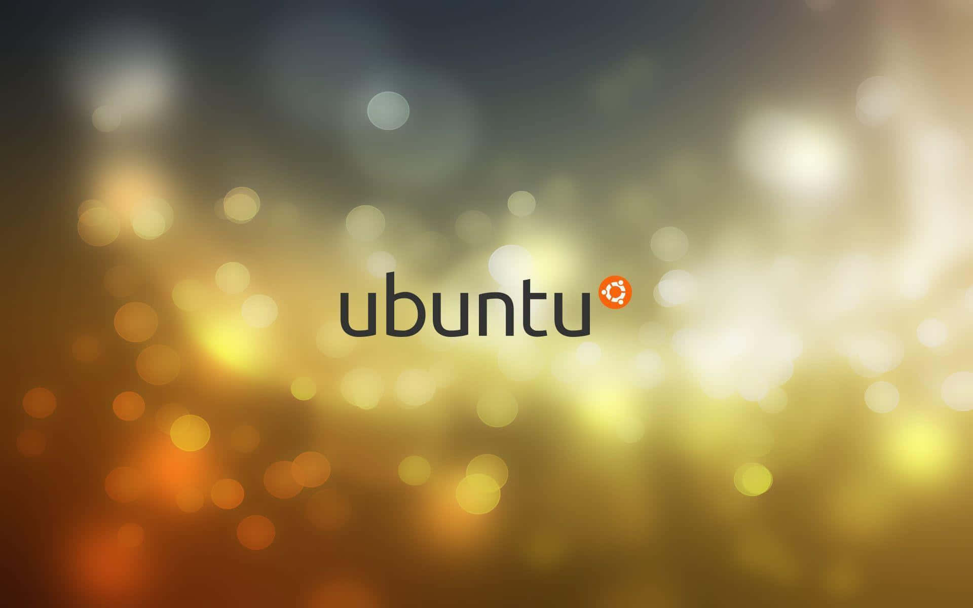 ubuntu 桌布 壁紙 — Ubuntu 標誌居中於溫暖金色散景背景，帶有柔和發光圓圈。
