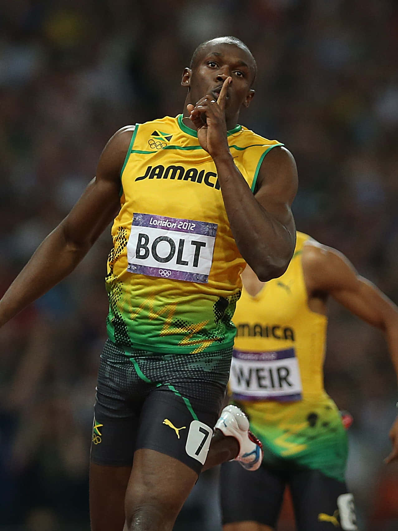 運動 桌布 壁紙 — Usain Bolt 身穿黃綠色牙買加球衣，在2012年倫敦奧運會短跑比賽中做出標誌性的「噓」手勢。
