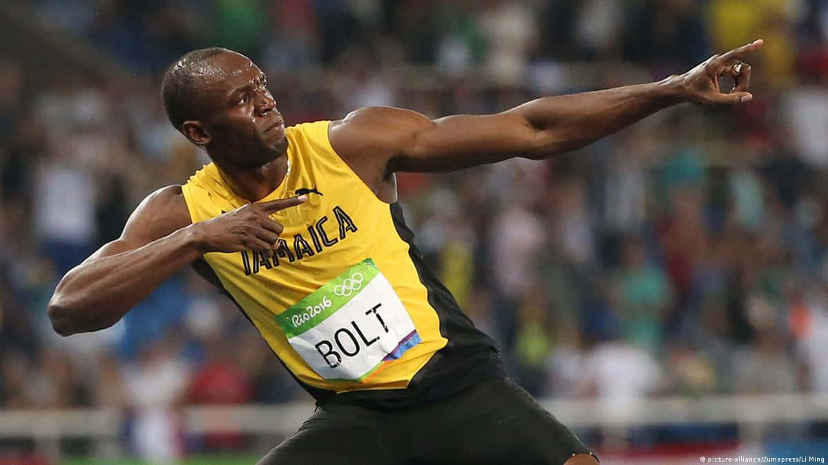 運動 桌布 壁紙 — Usain Bolt 身穿黃色牙買加球衣，在2016年里約奧運會上張開雙臂衝刺。