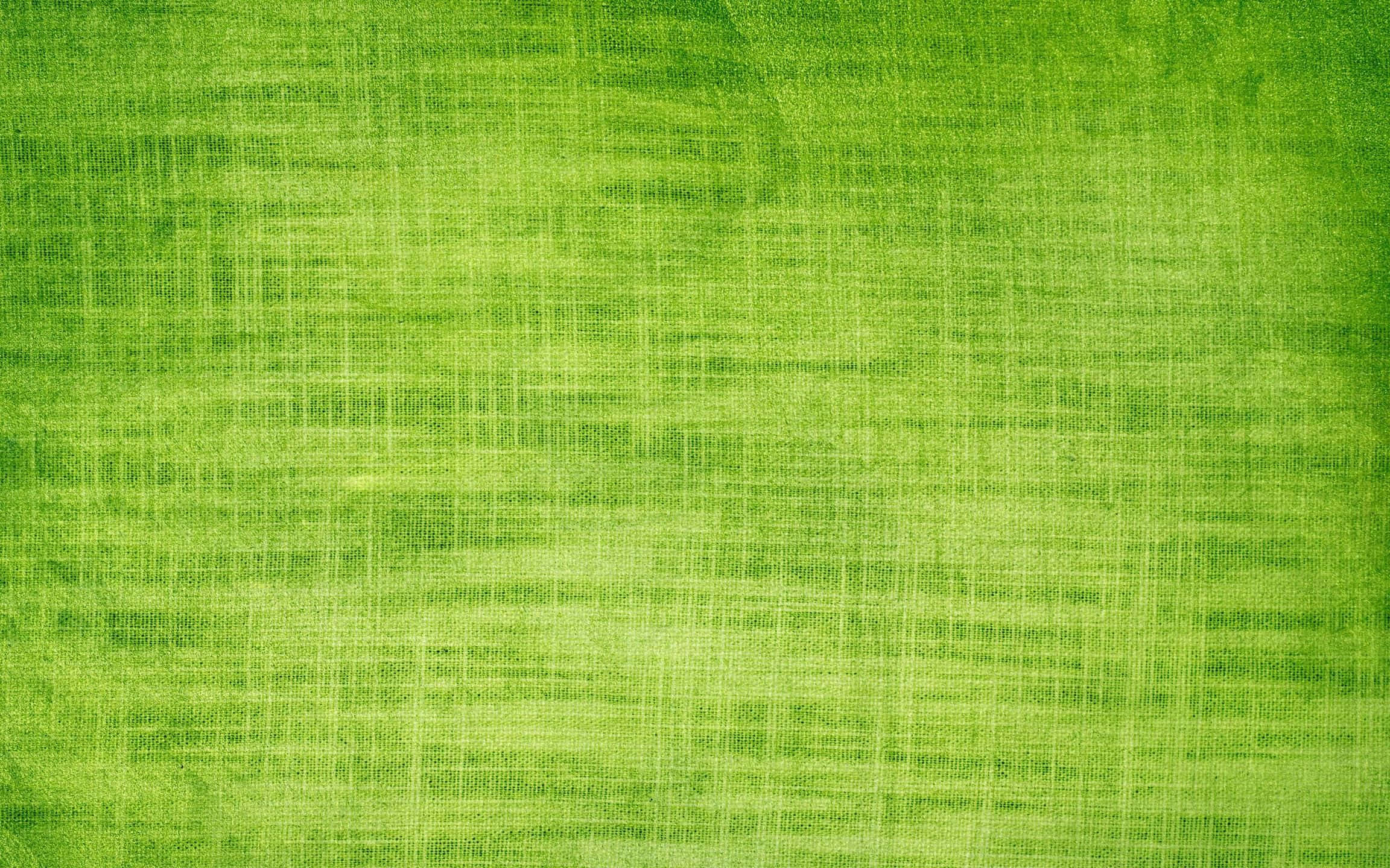 Green Texture 桌布 壁紙 — 充滿活力的綠色紋理布料，帶有編織圖案和微妙的漸變照明。