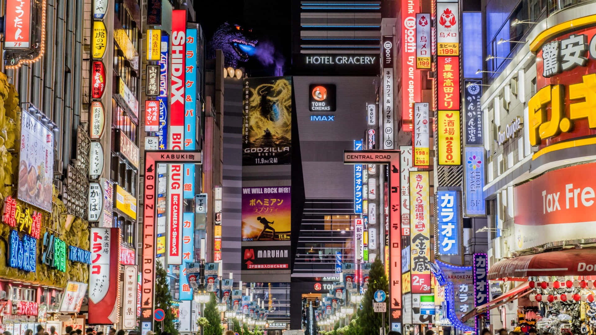 夜晚的東京街道，霓虹燈招牌和哥斯拉廣告閃閃發光。 — 東京 壁紙