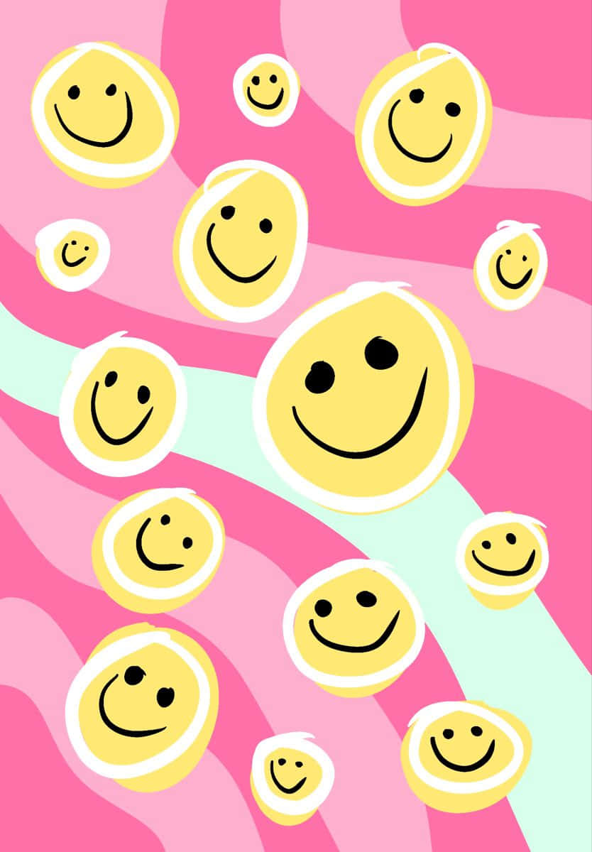 Pink Smiley Face 桌布 壁紙 — 充滿活力的粉紅色和薄荷漩渦，綻放出各種尺寸的快樂黃色笑臉。