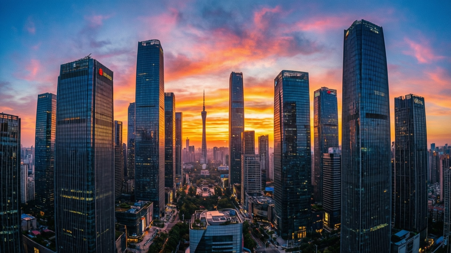 City Sunrise Skyline 壁紙 — 充滿活力的日落將天空染成火熱的橙色和粉紅色，高聳的玻璃摩天大樓在未來主義的城市景觀中反射出金色的光芒。
