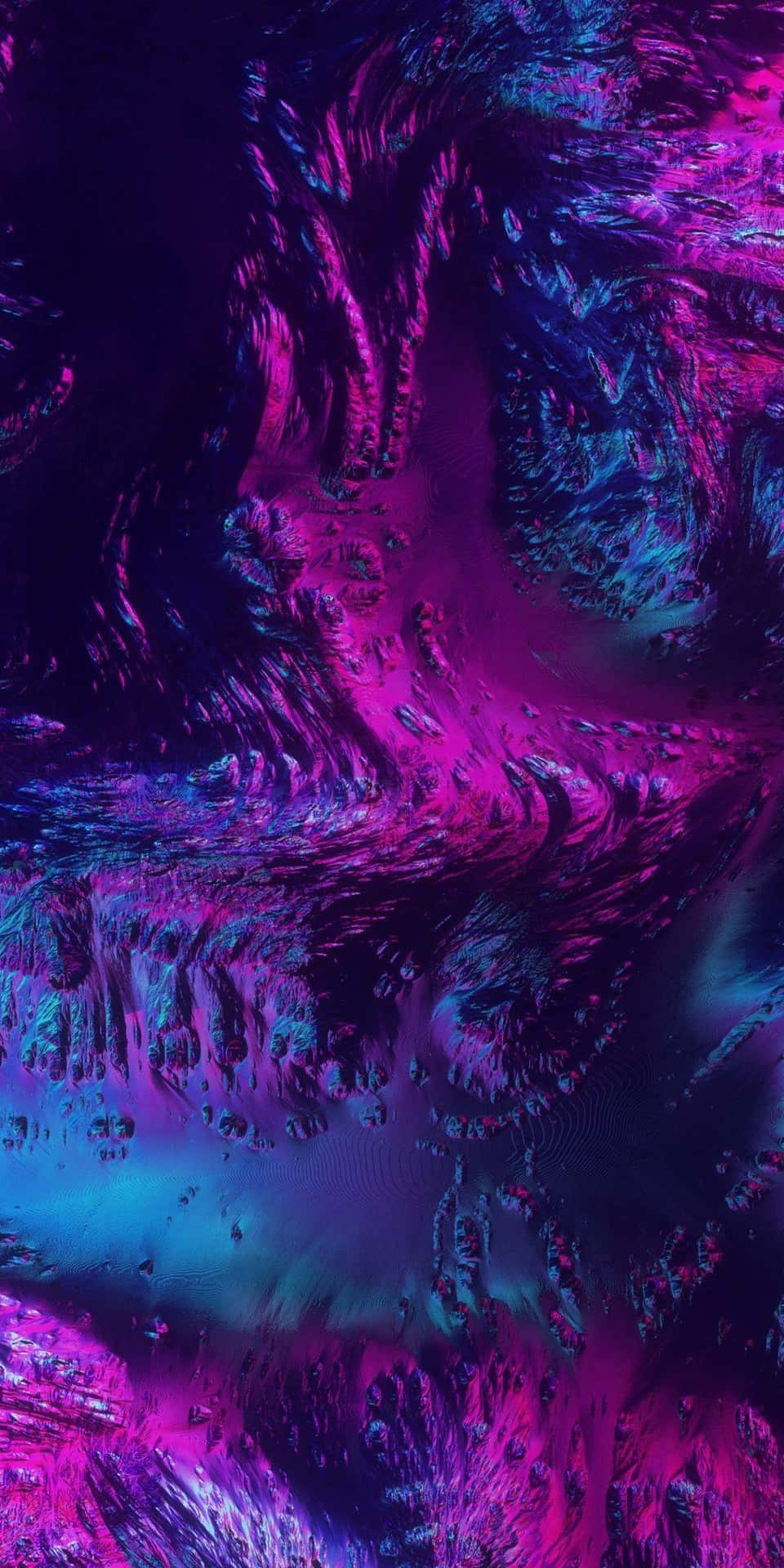  壁紙 — 充滿活力的旋轉星雲，呈現電光紫和藍綠色，帶有宇宙紋理和發光亮點。