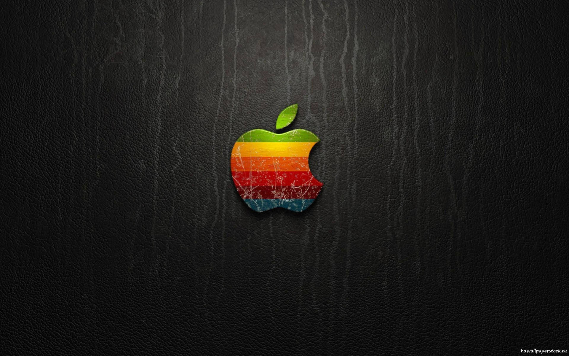 黑色皮革背景上的復古彩虹Apple標誌 — 4K 壁紙